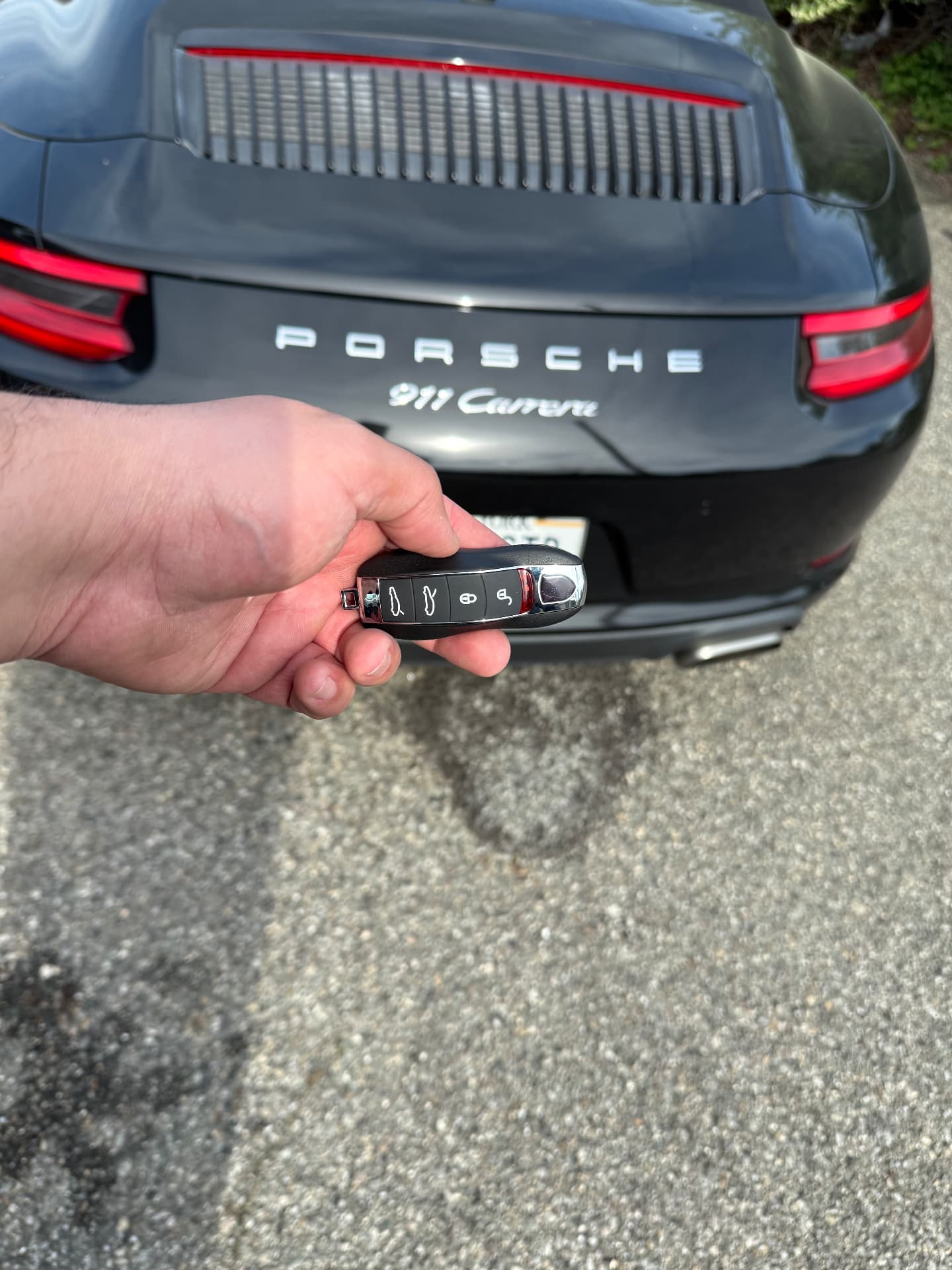 Elite Locksmith & Car Key technician unlocking a car door at night in Long Island